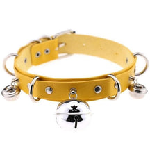 Yellow pleather cat bell collar with silver metal hardware and dangling bells made of faux leather