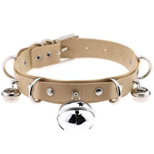 Beige pleather cat bell collar with silver metal hardware and a star design bell for stylish pet safety