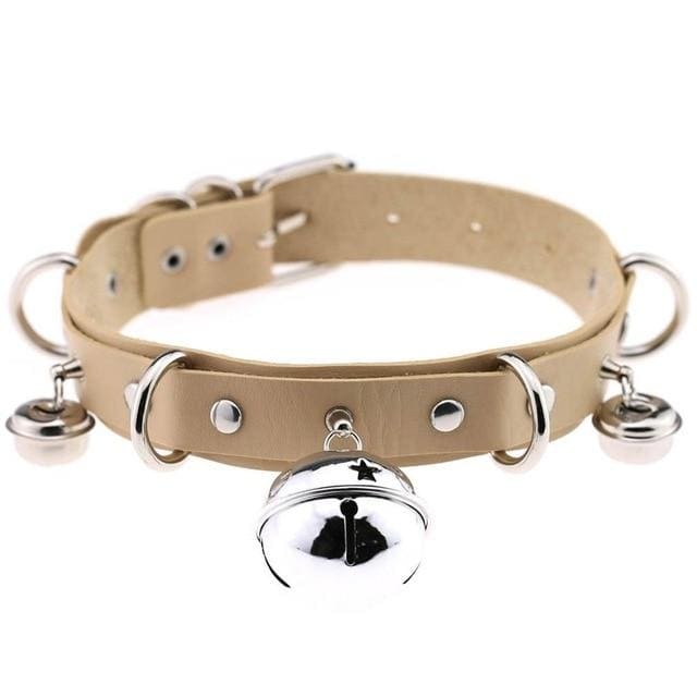 Beige pleather cat bell collar with silver metal hardware and a star design bell for stylish pet safety