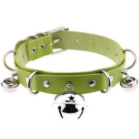 A lime green faux leather bell collar for cats with metal hardware featuring a central star bell and two smaller bells