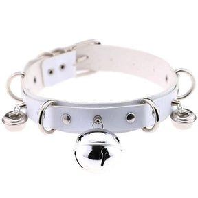 White faux leather bell collar with silver metal hardware featuring bells and rings for a pleather cat collar