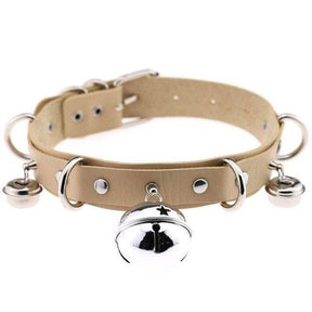 Beige pleather cat bell collar with silver metal hardware and dangling bells made of faux leather