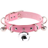 Pink pleather cat bell collar with silver metal hardware and dangling bells made of faux leather
