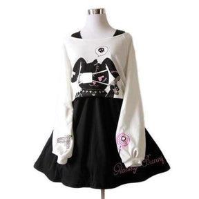 White and black long sleeve psycho bunny dress with stitched cat graphic pink accents and embroidered text hem
