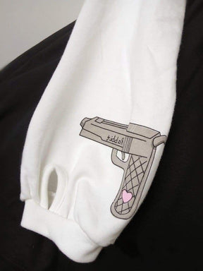 White psycho bunny dress sweatshirt sleeve with gray cartoon handgun and pink heart graphic long sleeve evil style