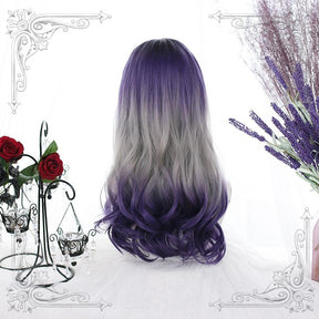 Rear view of the long purple and gray wig, showing a dark violet crown, broad silver-gray middle section and curled purple ends.