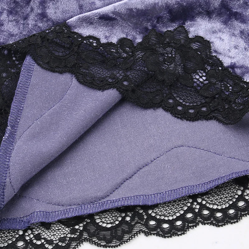 Inside lower edge of the purple camisole, showing the stitched seam and black scalloped lace trim.