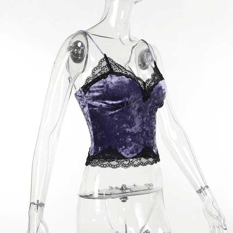 Side angle of the purple velvet camisole on a clear mannequin, showing the curved bust and lace-trimmed hem.