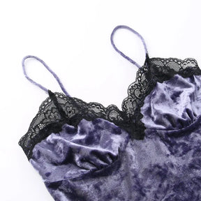Close view of the purple camisole laid flat, showing fine straps, scalloped floral lace and gathered bust seams.