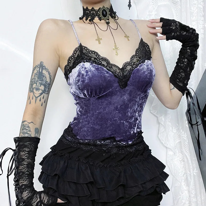Three-quarter view of the purple camisole with a hand at the shoulder, showing the contrast between the velvet body and black lace edges.