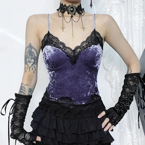 Front view of the purple lace camisole with a hand at the waist, showing its fitted outline and scalloped lower edge.