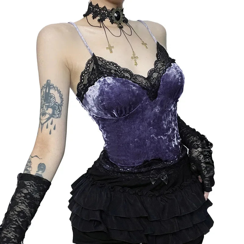 Angled view of a purple velvet camisole with black floral lace, narrow shoulder straps and curved bust seams.