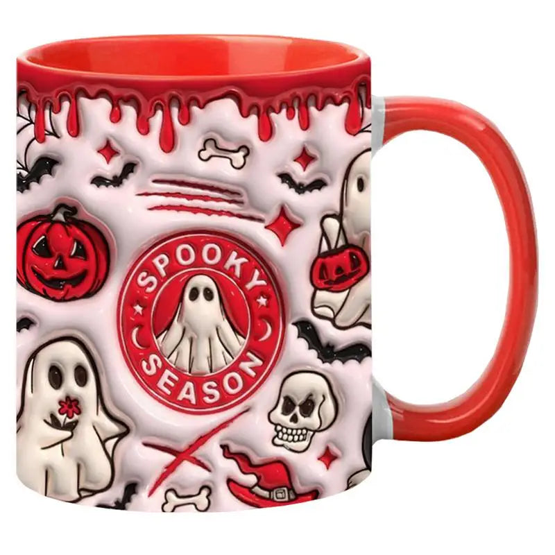 Spooky Season mug with a red handle and interior, white ghosts, red pumpkins and skull details on a white background.