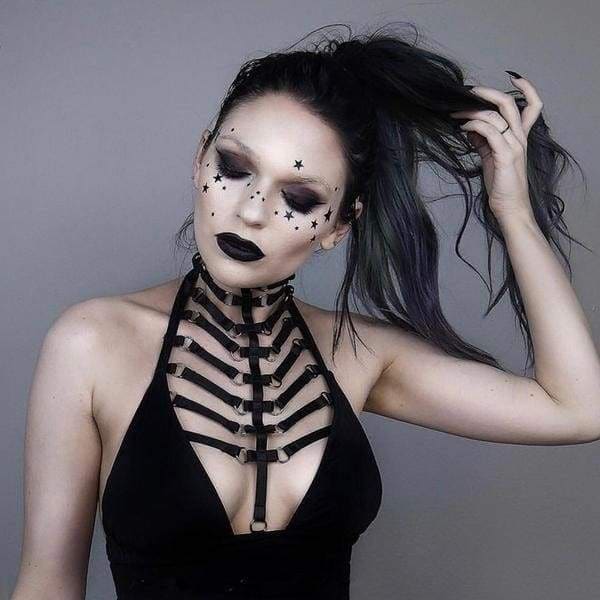 Black ribbed skeletal harness top with adjustable straps and metal hardware shown from the back side