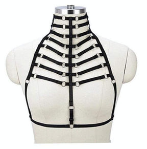 Front mannequin view of the black ribcage strap harness, with a multi-band choker, central vertical strap and underbust band.