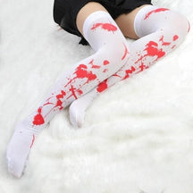 White thigh-high skeleton bone stockings with red splatter patterns perfect for spooky bone stockings look