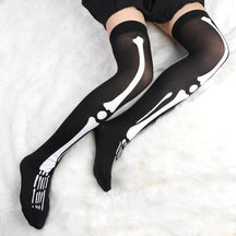 Black thigh-high skeleton bone stockings with white bone design perfect for spooky stylish looks