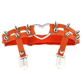 Orange leather garter belt with silver spikes and a heart-shaped metal centerpiece for a spiky heart garter look