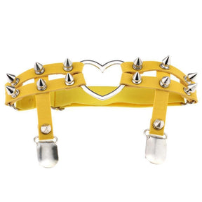 Yellow leather spiky heart garter belt with silver spikes and heart-shaped metal centerpiece for edgy style