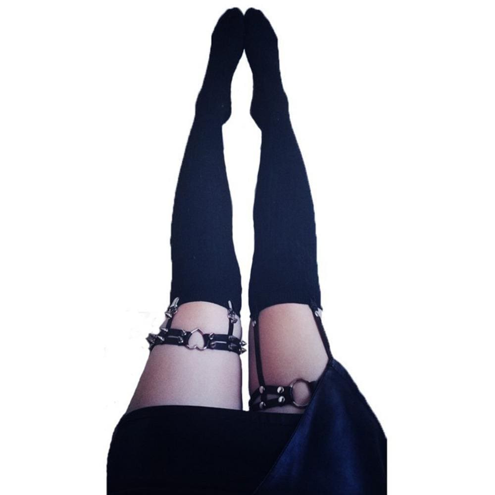Black leather thigh high stockings with silver studs and hardware paired with spiky heart garter belt