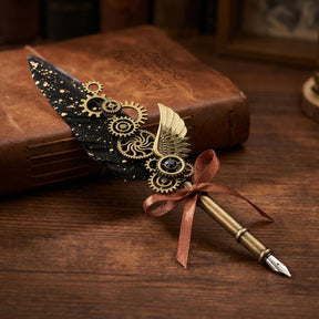 Black steampunk feather quill pen with decorative gears, a wing ornament and ribbon bow