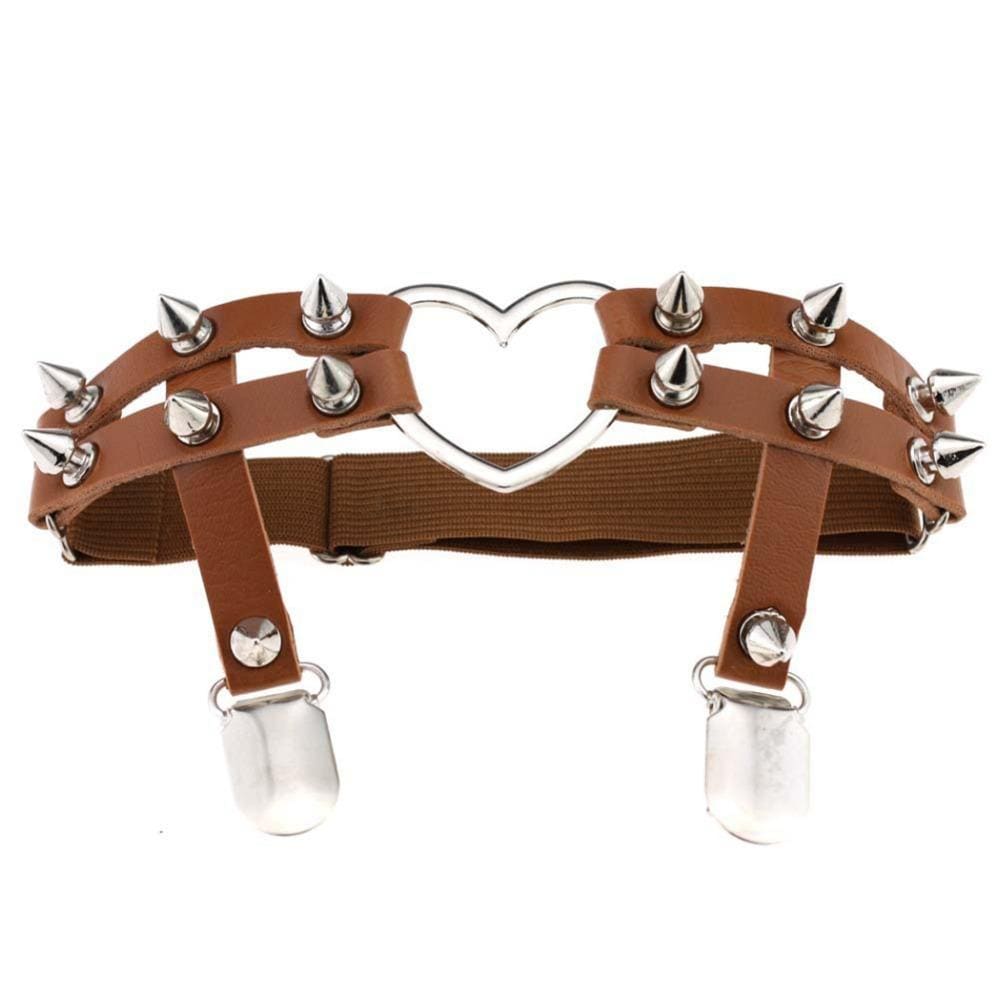 Tan thigh garter with two parallel straps, silver-tone cone spikes and a central open heart, finished with two stocking clips.