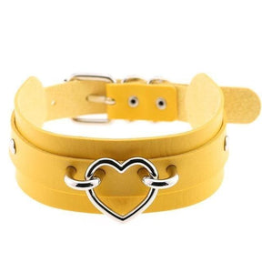 Yellow vegan leather heart collar with a silver heart-shaped buckle perfect for edgy fashion looks
