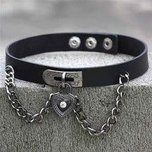 Black leather locket choker with silver heart locket pendant featuring clear gemstone on chain clasp