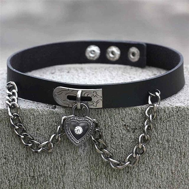 Black leather locket choker with silver heart locket pendant featuring clear gemstone on chain clasp