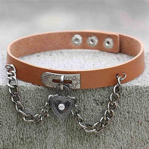 Tan leather victorian locket choker with silver clasp and heart locket pendant featuring a central gemstone