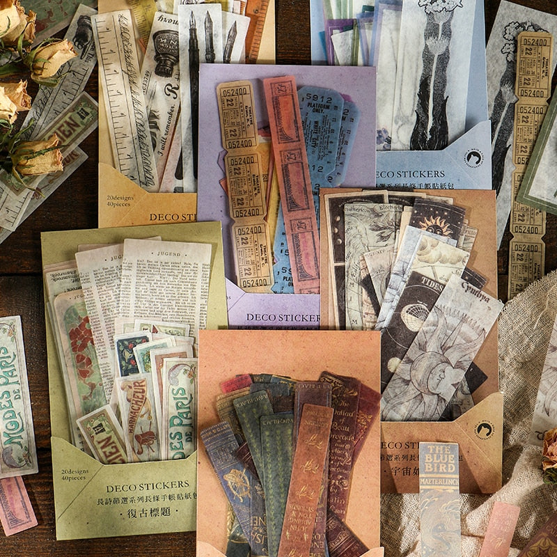 Themed vintage sticker packs displayed together with long botanical labels, colourful tickets, celestial prints and book-like strips.