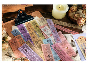 Pink, yellow, blue and purple ticket stickers arranged across a clipboard with repeated vintage-style numbers and print.