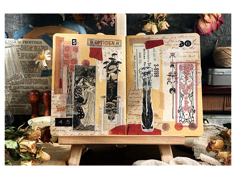 Open journal decorated with overlapping long vintage stickers, numbers, faded print and narrow botanical illustrations.