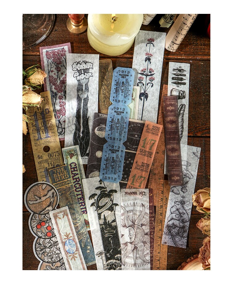 A selection of long vintage stickers arranged vertically, mixing botanical drawings, tickets, celestial diagrams and printed text.