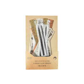 Tan decorative sticker packet displaying long vintage pen-like illustrations and narrow printed strips.