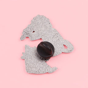 Back of the witch cat enamel pin showing its single black clutch fastening