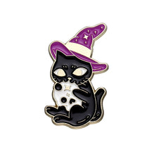 Black cat wearing a purple witch hat and holding a small white skull, outlined in gold-tone against white.