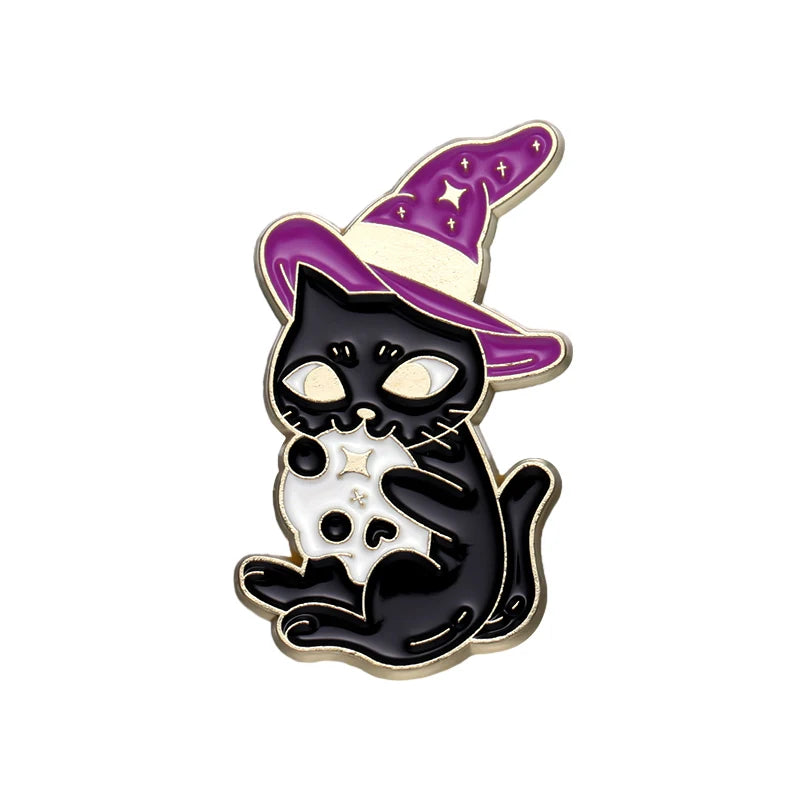 Black cat wearing a purple witch hat and holding a small white skull, outlined in gold-tone against white.