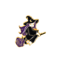 Enamel pin of a purple-haired witch riding a broom, with a black pointed hat, crescent detail and gold-tone outlines.