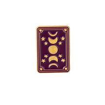 Rectangular purple enamel pin with a vertical sequence of gold-tone moon phases, stars and a fine double border.