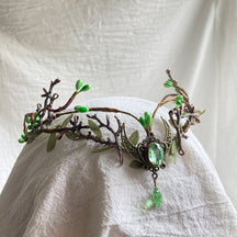 Leafy woodland tiara with branching antlers, a crescent centre and pale green oval accent with a matching hanging drop.