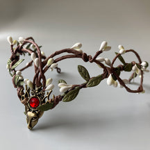Branch-style elf tiara with pale buds, green leaves and a bright red round centre accent.