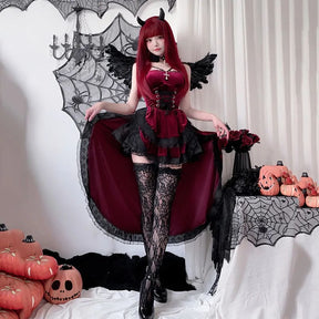 Model spreading the skirt of a burgundy gothic high-low dress to show its long back hem and black lace trim.