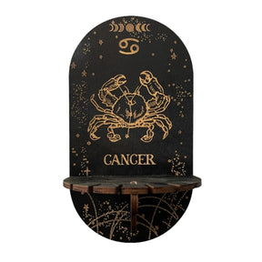 Black Cancer display shelf with a gold-tone crab illustration, constellation lines and a small projecting platform.
