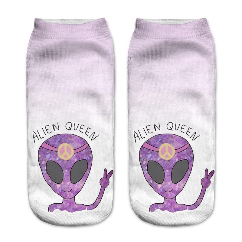 Pale lavender socks printed with purple alien heads, peace signs and the words Alien Queen, shown side by side.