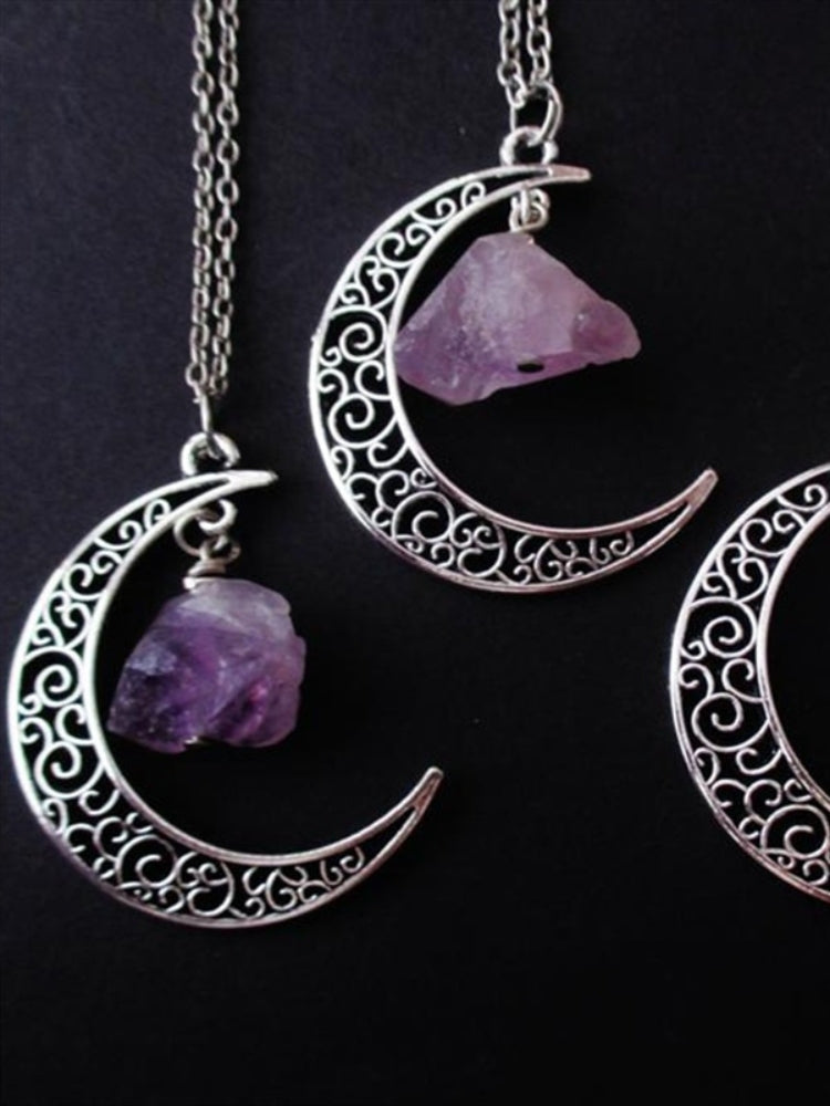 Amethyst crescent moon necklace in the Filigree Crescent design, shown in a close group on black.
