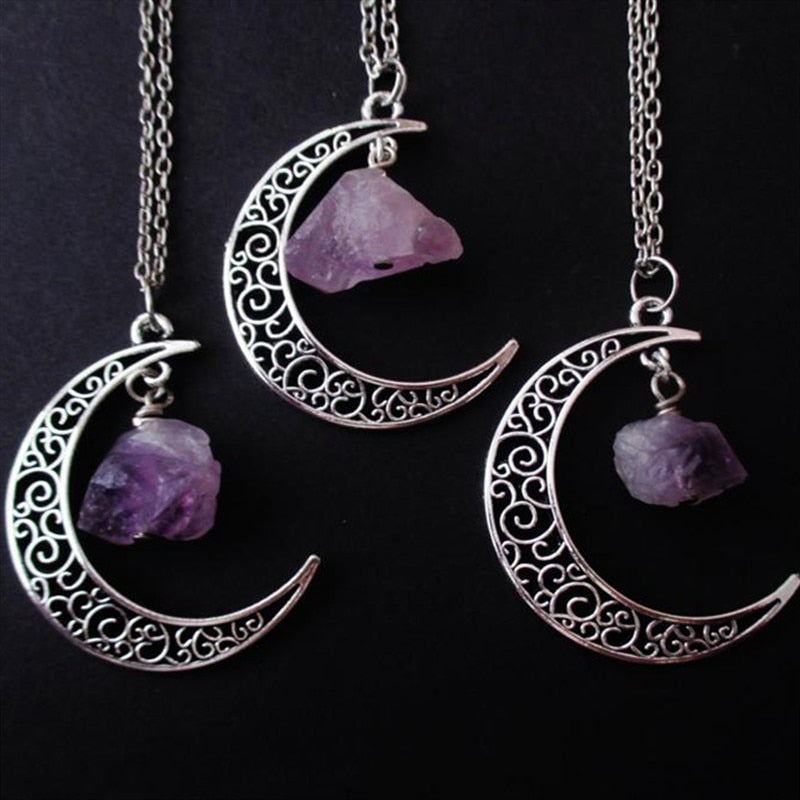 Amethyst crescent moon necklace in the Filigree Crescent design with three pendants and chains on black.