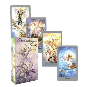 Fantasy tarot deck with its illustrated box and several cards, showing winged figures and softly coloured scenes.