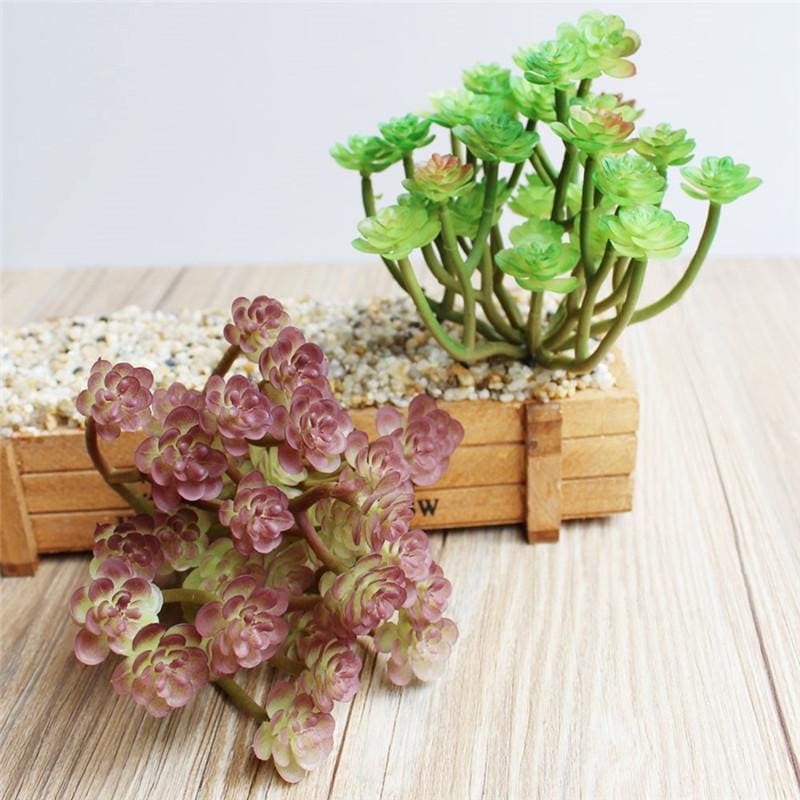 Green and purple artificial succulent branches displayed together, each with several small rosette heads.