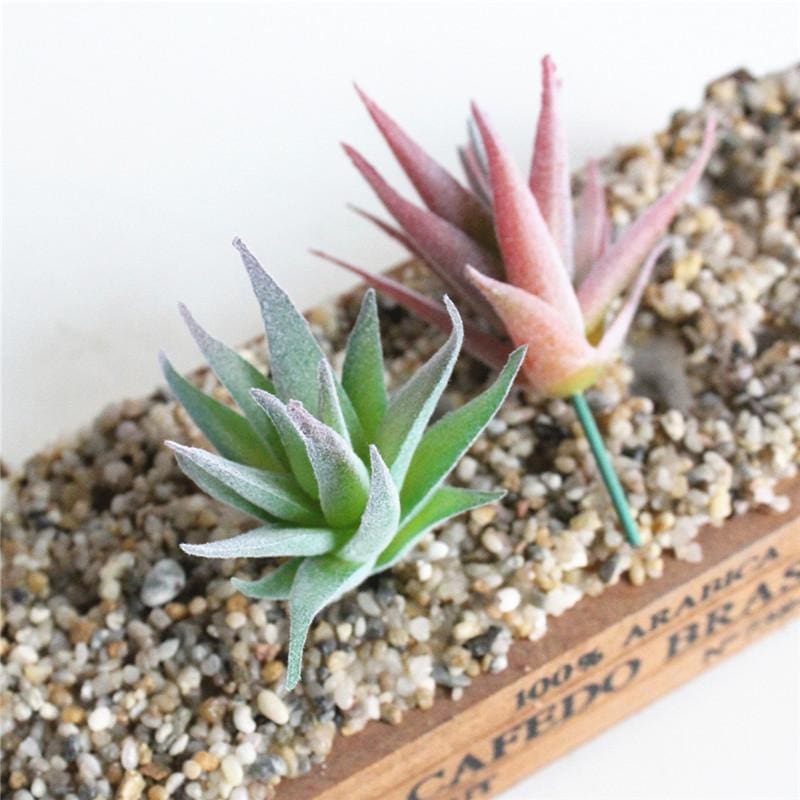 Pink and green narrow-leaf artificial succulent stems shown together for comparison.